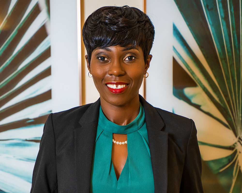 Profile Photo of Michelle Shepherd in a turquoise blouse and black blazer